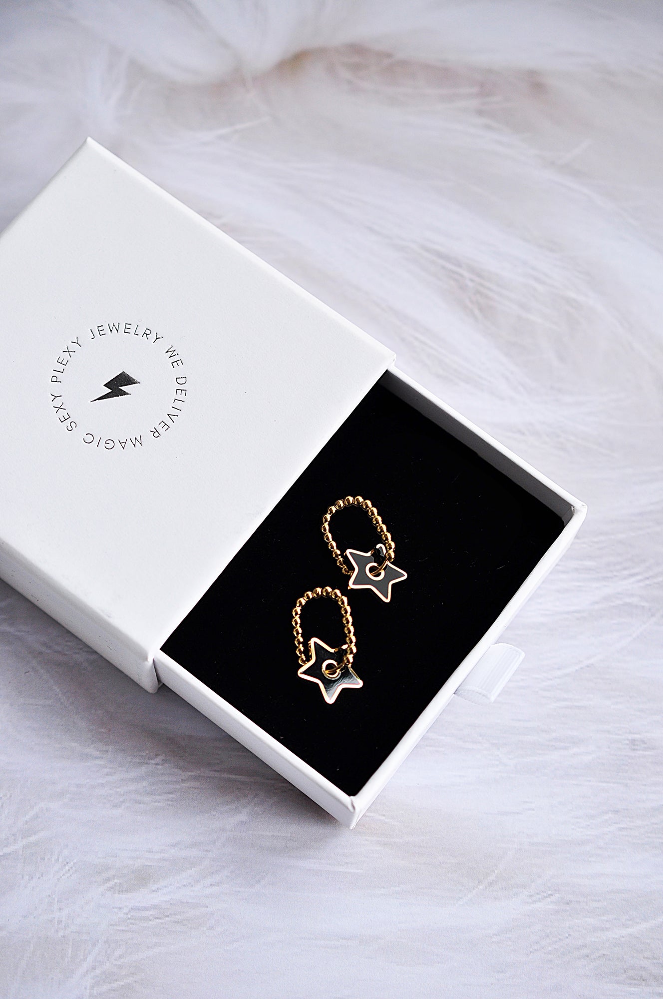 Ovale Creolen mit Tropfendesign „Black Star“ 